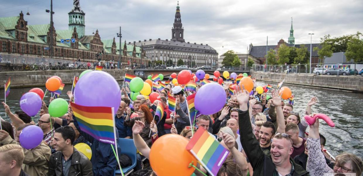A lively canal tour during Pride Week in Copenhagen, Denmark