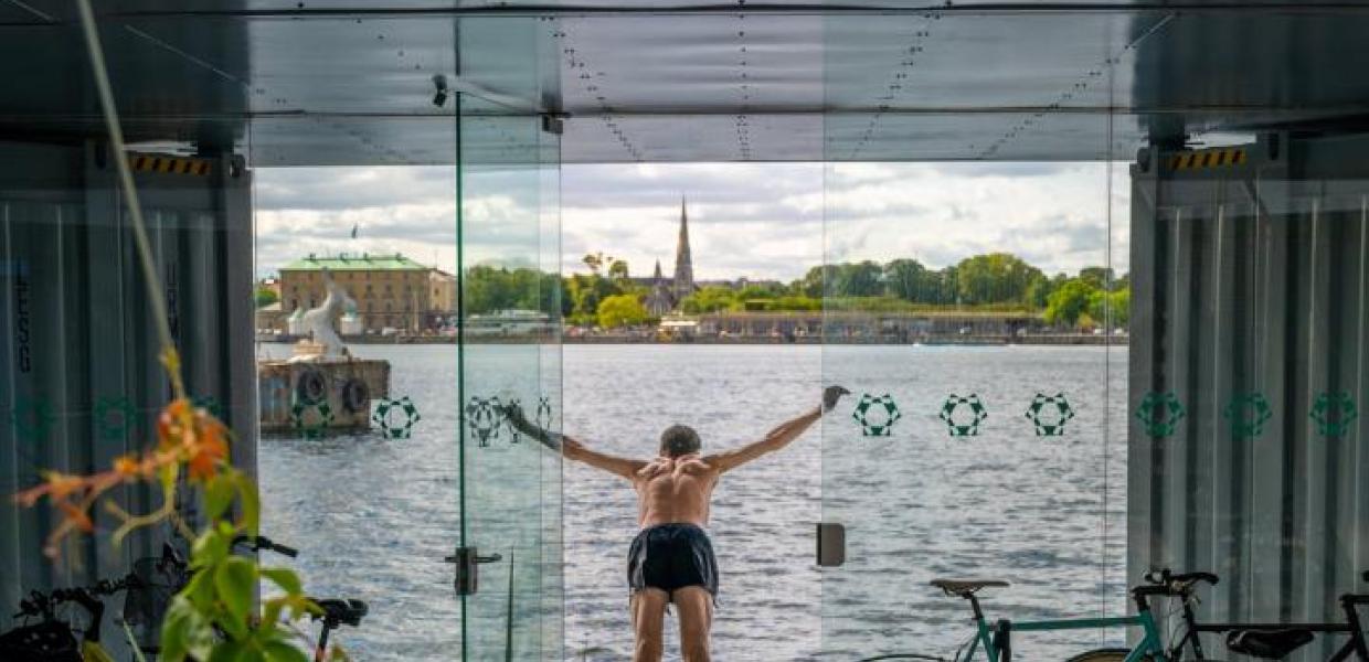 A man dives into the harbour at Urban Rigger, Copenhagen, Denmark