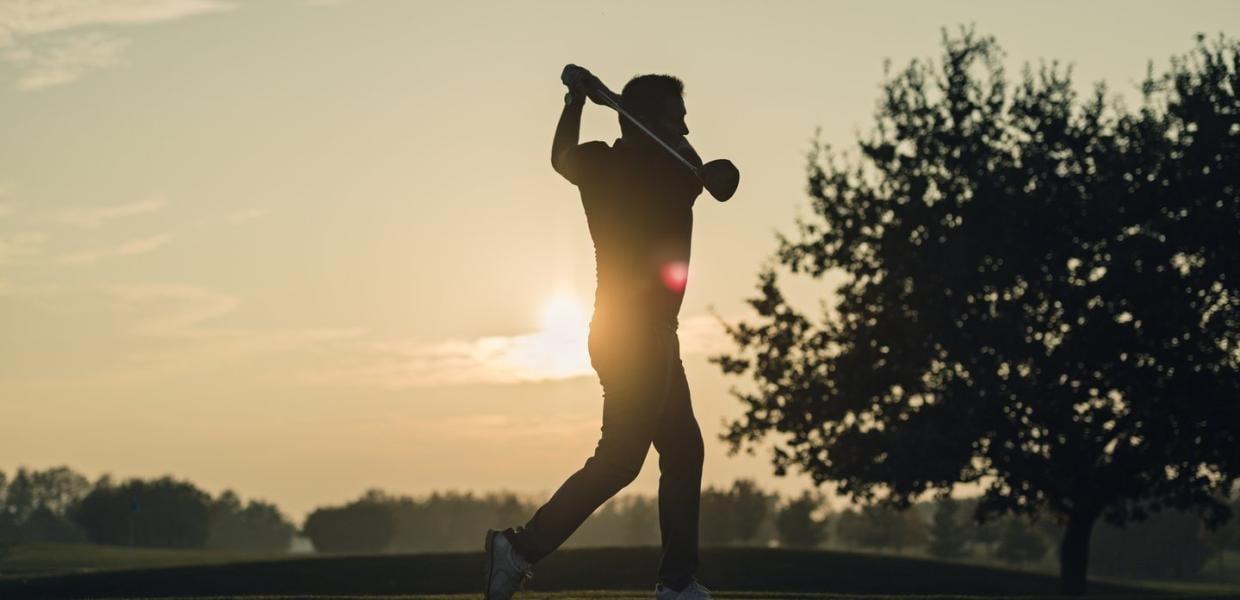 Golfing session during sunset at golf center on Møn, South Zealand