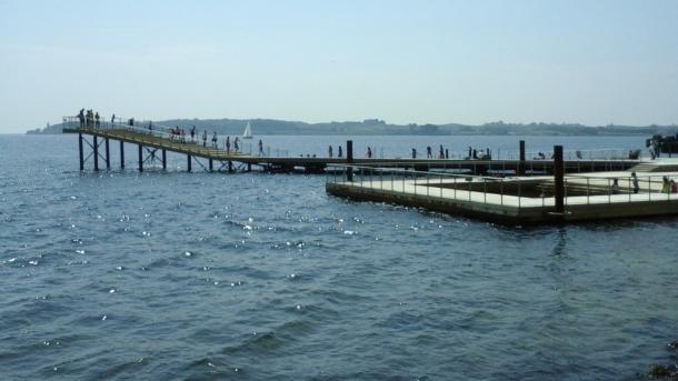 People enjoying the water at Faaborg Harbour Baths in Denmark
