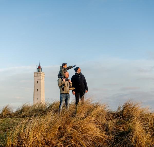 Family on Blåvand beach near Blåvandshuk Lighthouse, West Jutland