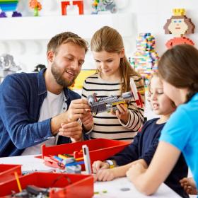 A family plays with LEGO at LEGO House, Billund, Denmark