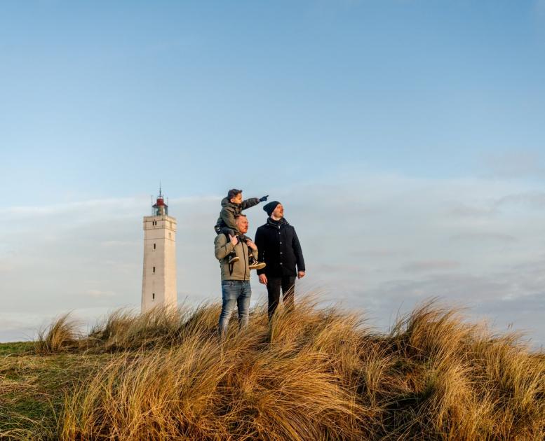 Family on Blåvand beach near Blåvandshuk Lighthouse, West Jutland